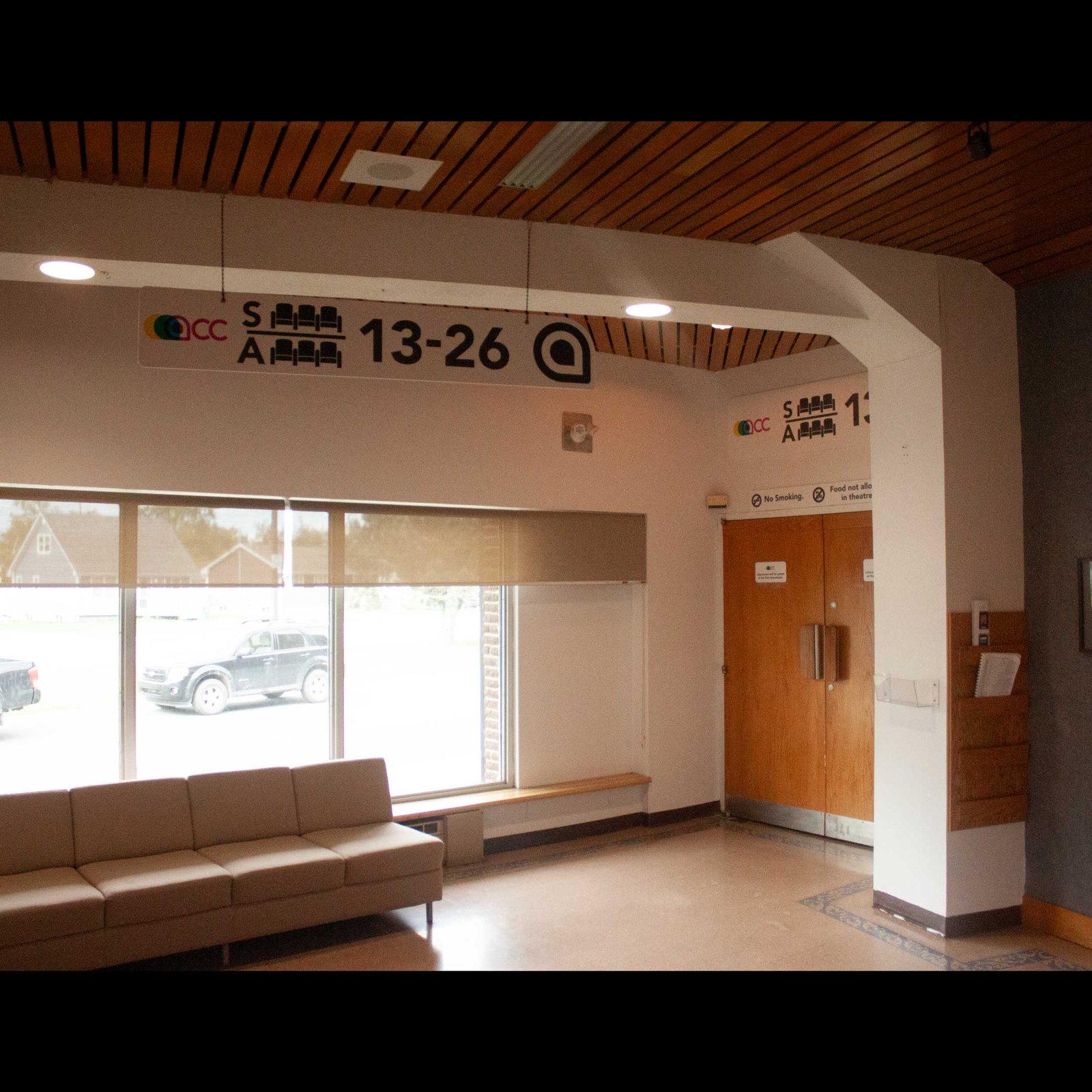 View of the lobby looking left from the front entrance. Seats 13-26 are clearly labeled