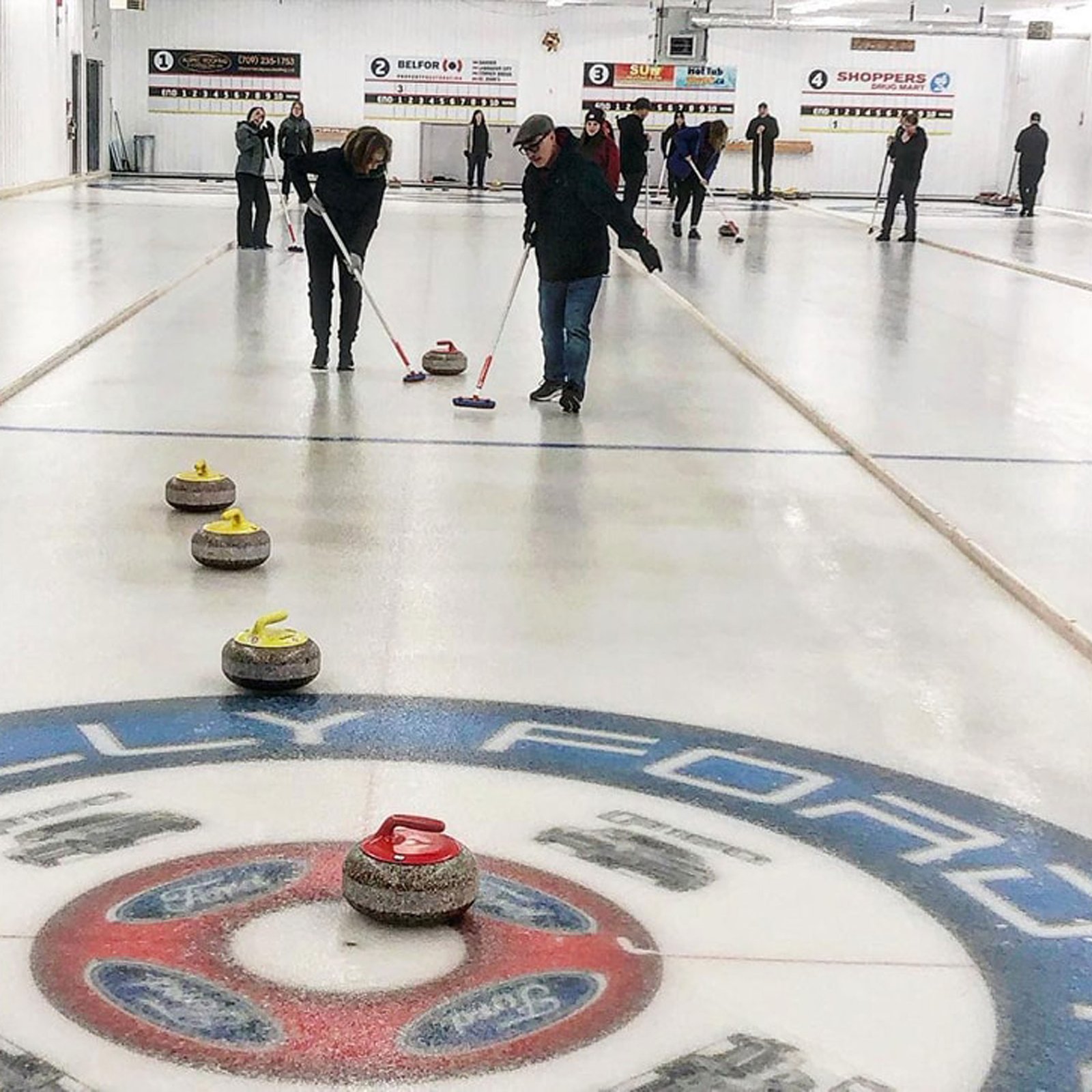 Some curlers curling at the Gander Curling Club