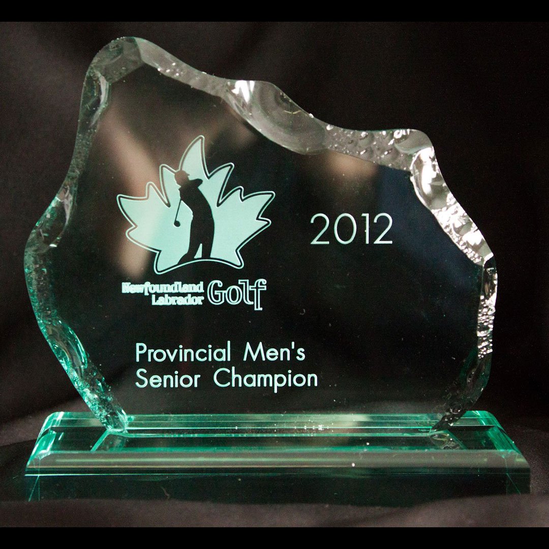 Acrvlic trophy shaped like an iceberg with the NL Golf Logo on it. It reads, Newfoundland Labrador Golf Provincial Men's Senior Champion 2012