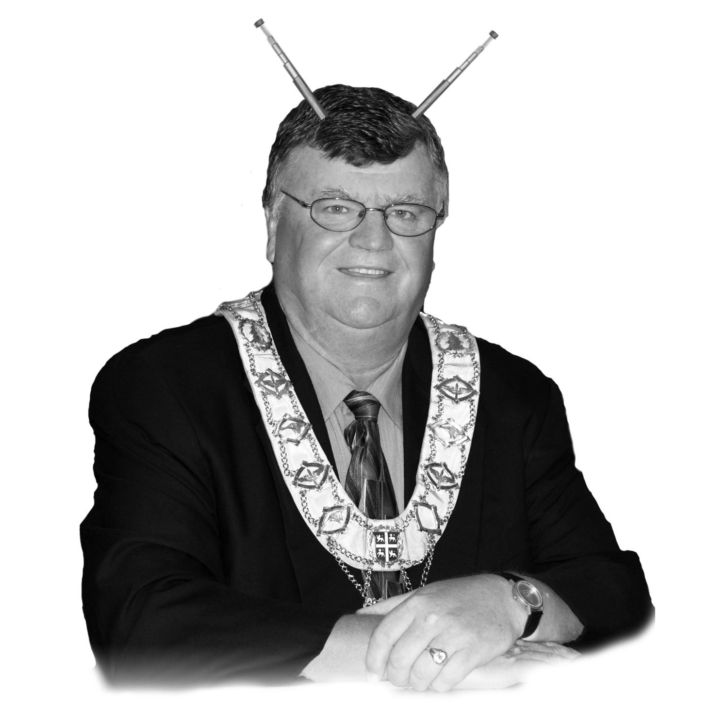 Photo of former mayor Claude Elliott with antenna telescoping from his head.